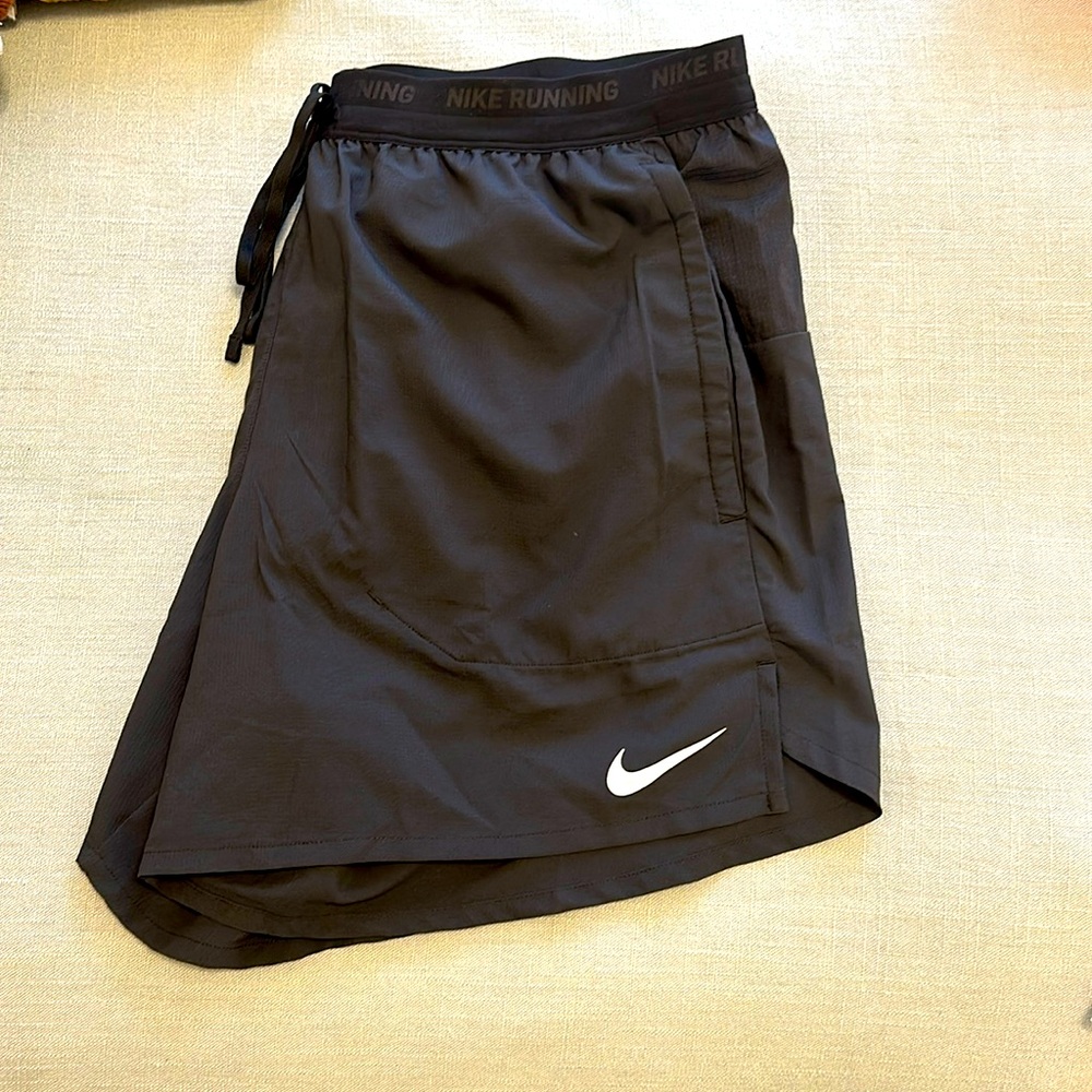 Nike black running shorts with pockets and zippered pocket on back!